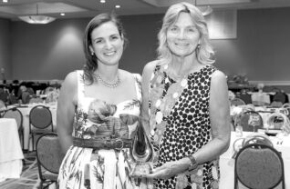 Rebecca Feigen, a niece of Ike Wolgin, and Michelle Pollock, Ike’s longtime partner, accepted the Killeen Lake Protector Award given to Ike Wolgin posthumously on his behalf at the LGA’s annual gala, held July 10 at the Sagamore. Photo by Holly Clark. Courtesy LGA